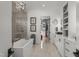 Luxurious bathroom featuring a soaking tub, glass shower, and elegant vanity at 132 Edward Booth Ln, Durham, NC 27713