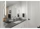 Modern bathroom with a double vanity, sleek fixtures, and a large mirror at 132 Edward Booth Ln, Durham, NC 27713