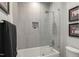 Clean bathroom featuring a shower with glass enclosure, neutral tiles, and a gray towel at 132 Edward Booth Ln, Durham, NC 27713