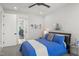Bright bedroom featuring a comfortable bed, modern ceiling fan, and stylish wall decor at 132 Edward Booth Ln, Durham, NC 27713