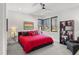 Cozy bedroom with a large bed, ambient lighting, and a view of the outdoors at 132 Edward Booth Ln, Durham, NC 27713