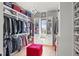 Custom walk-in closet featuring custom shelving, cabinets, and a central window seat at 132 Edward Booth Ln, Durham, NC 27713