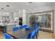 Bright dining room features a large table with seating, modern lighting, and a climate-controlled wine storage at 132 Edward Booth Ln, Durham, NC 27713