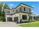 Striking contemporary home showcasing a two-car garage, sleek lines, and meticulous landscaping at 132 Edward Booth Ln, Durham, NC 27713