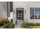 Modern home exterior featuring a stylish front door with glass panels and contemporary lighting at 132 Edward Booth Ln, Durham, NC 27713