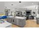 Spacious, bright kitchen with a central island, modern appliances, and an open layout, seamlessly connecting to the living area at 132 Edward Booth Ln, Durham, NC 27713