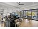 Open concept living room with access to the kitchen, dining area, and outdoor patio at 132 Edward Booth Ln, Durham, NC 27713