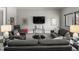 Comfortable living room with a flat-screen TV and modern furniture arrangement at 132 Edward Booth Ln, Durham, NC 27713