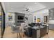 Open concept living room featuring a modern fireplace and an abundance of natural light at 132 Edward Booth Ln, Durham, NC 27713
