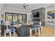 Modern living room with fireplace, comfortable seating, and sliding glass doors to the outdoor space at 132 Edward Booth Ln, Durham, NC 27713