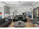 Open-concept living room seamlessly connects to the kitchen, dining area, and outdoor spaces at 132 Edward Booth Ln, Durham, NC 27713