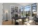 Bright home office with a large desk, bookshelf, and large windows with scenic views at 132 Edward Booth Ln, Durham, NC 27713