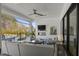 Inviting outdoor patio with comfortable seating, a fireplace, and views of the pool and backyard at 132 Edward Booth Ln, Durham, NC 27713