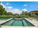Beautiful pool area with a jacuzzi tub, lounge chairs, and lush green surroundings at 132 Edward Booth Ln, Durham, NC 27713