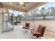 Relaxing screened porch with ceiling fan, outdoor seating, and views of backyard at 1336 Santa Lucia St, Wake Forest, NC 27587