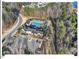 Aerial shot of community pool and clubhouse with lounge areas and well-manicured landscaping at 153 Abercorn Cir, Chapel Hill, NC 27516