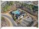 Aerial shot of community pool and clubhouse with lounge areas and well-manicured landscaping at 153 Abercorn Cir, Chapel Hill, NC 27516