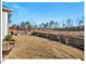 Spacious backyard features a lawn with views of trees and the sky at 153 Abercorn Cir, Chapel Hill, NC 27516
