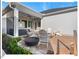 Inviting stone patio features seating and a planter and a covered area with hot tub at 153 Abercorn Cir, Chapel Hill, NC 27516