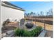 Backyard with patio, seating, greenery, and views of the trees at 153 Abercorn Cir, Chapel Hill, NC 27516