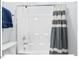 Neat shower and tub with gray striped shower curtain and modern fixtures, offering a comfortable and well-maintained space at 153 Abercorn Cir, Chapel Hill, NC 27516