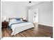 Bright bedroom with natural light, featuring a cozy bed with stylish blue accents, perfect for relaxation and restful nights at 153 Abercorn Cir, Chapel Hill, NC 27516