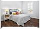 Cozy bedroom with hardwood floors, a comfortable bed, and a bright window, creating a serene and restful atmosphere at 153 Abercorn Cir, Chapel Hill, NC 27516