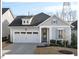 Charming single-Gathering home with a two-car garage, blue shutters, and well-maintained lawn at 153 Abercorn Cir, Chapel Hill, NC 27516