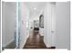 Inviting hallway with hardwood floors leads to a bright and airy living space, enhancing the home's modern feel at 153 Abercorn Cir, Chapel Hill, NC 27516