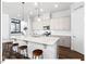 Modern kitchen featuring granite countertops, white cabinets, a center island, and stainless steel appliances at 153 Abercorn Cir, Chapel Hill, NC 27516