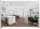 Bright and spacious open concept living space with hardwood floors and modern lighting, perfect for gatherings at 153 Abercorn Cir, Chapel Hill, NC 27516