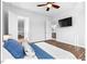 Bright main bedroom features a ceiling fan, and a modern TV on the wall at 153 Abercorn Cir, Chapel Hill, NC 27516