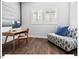 Modern office with hardwood floors, comfortable seating, and ample natural light, perfect for work or study at 153 Abercorn Cir, Chapel Hill, NC 27516