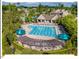 Aerial shot of the community pool area featuring a lap pool, sun deck, and lush landscaping at 153 Abercorn Cir, Chapel Hill, NC 27516