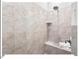 Tiled walk-in shower with showerhead and tiled bench at 153 Abercorn Cir, Chapel Hill, NC 27516