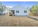 Back of house with covered porch and expansive backyard surrounded by trees at 20 Hickory Hollow Cir, Youngsville, NC 27596