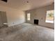 Unfinished living room with natural light, featuring sheetrocked walls and doorway to another room at 20 Trescott St, Smithfield, NC 27577