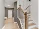 Inviting home entryway features wood floors and staircase with a custom railing leading upstairs at 2001 Regal Dr # 89, Durham, NC 27703