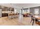 Open concept kitchen and living space with an island, stainless steel appliances, and hardwood flooring at 2001 Regal Dr # 89, Durham, NC 27703