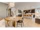 Open floor plan with dining room leading to the kitchen area featuring modern cabinets and kitchen island with seating at 2001 Regal Dr # 89, Durham, NC 27703