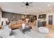 Bright living room open to kitchen with ceiling fan, modern furnishings, and hardwood flooring throughout at 2001 Regal Dr # 89, Durham, NC 27703