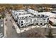 Aerial view of modern townhome community with rooftop terraces, garages, and street parking at 2002 Moody Ln, Durham, NC 27701