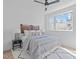 Bright bedroom with contemporary decor, a comfortable bed, and a large window offering abundant natural light at 2002 Moody Ln, Durham, NC 27701