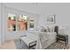 Bright bedroom with a large window, stylish decor, and a comfortable, well-appointed queen-sized bed at 2002 Moody Ln, Durham, NC 27701