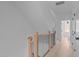 Upstairs hallway featuring hardwood floors, modern railings, and white doors for a clean, contemporary aesthetic at 2002 Moody Ln, Durham, NC 27701