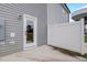 Back patio and rear entrance of home with privacy fence at 2003 Regal Dr # 90, Durham, NC 27703