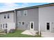Backyard view of the townhouse features a patio and an outdoor grass area with a privacy fence at 2003 Regal Dr # 90, Durham, NC 27703