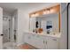 Bathroom features double sinks, white cabinets, a large mirror, and modern lighting at 2003 Regal Dr # 90, Durham, NC 27703