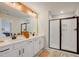 Bathroom with a double vanity, modern lighting, a walk-in shower, and neutral finishes at 2003 Regal Dr # 90, Durham, NC 27703
