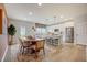 Dining area and kitchen with white cabinets, stainless steel appliances, and bar seating at 2003 Regal Dr # 90, Durham, NC 27703
